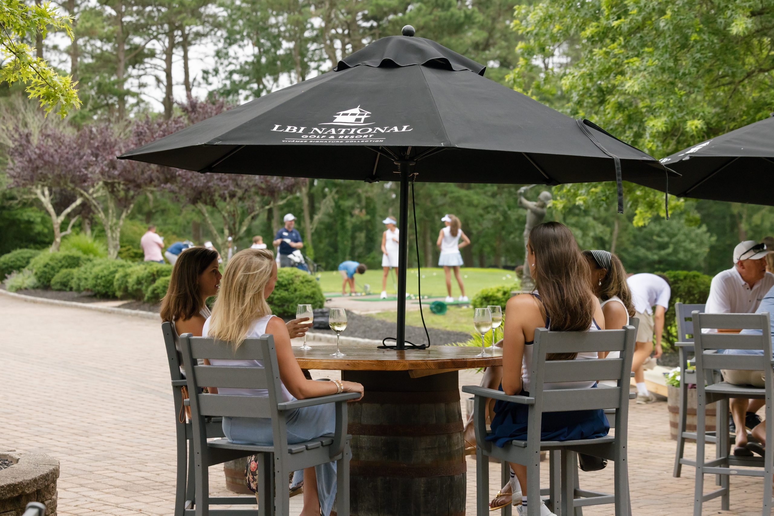 People seated at The Tin Cup on the 18th hole at LBI National Golf Resort