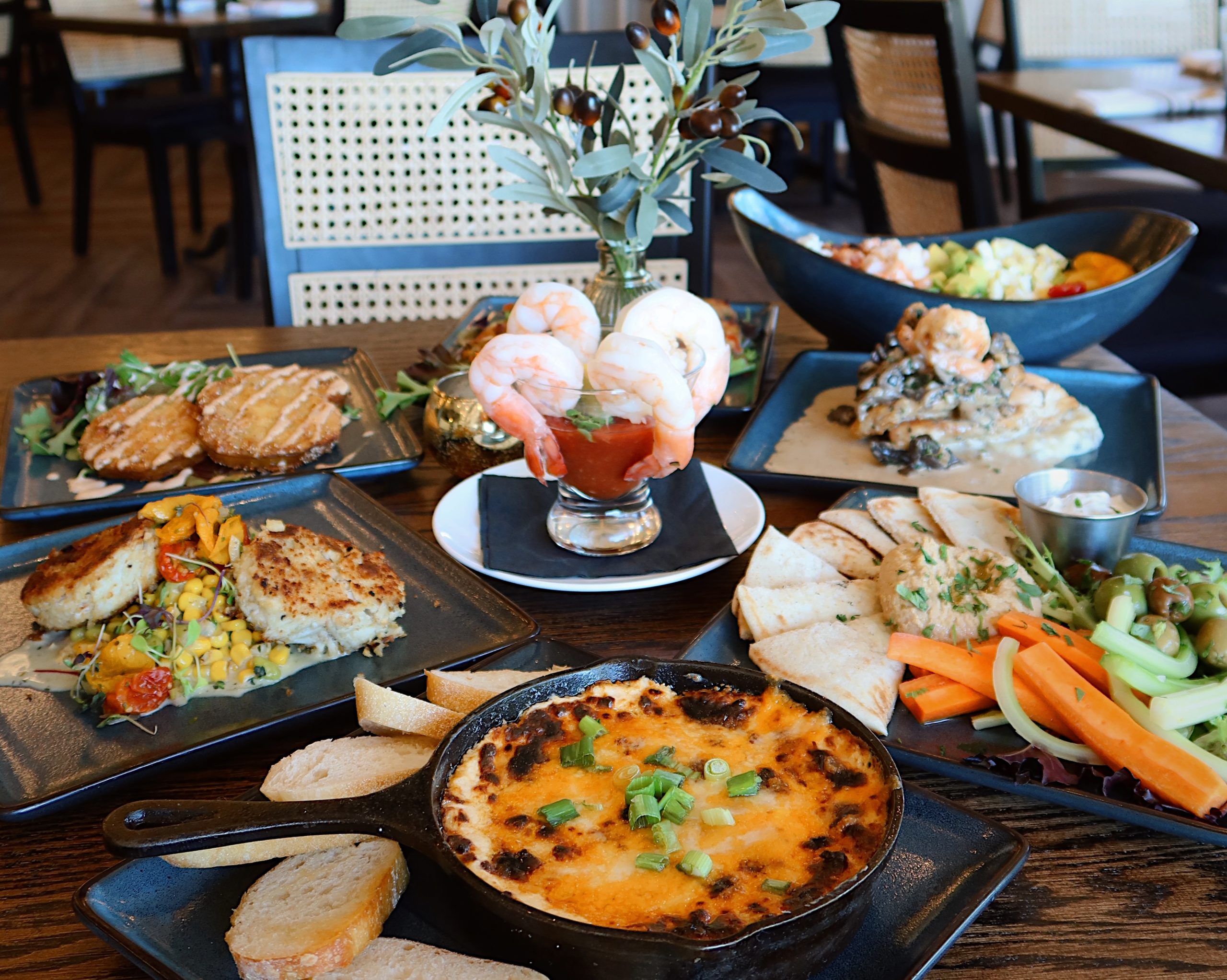A tablescape of summer seasonal coastal dishes at The Wickie Room at LBI National Golf & Resort