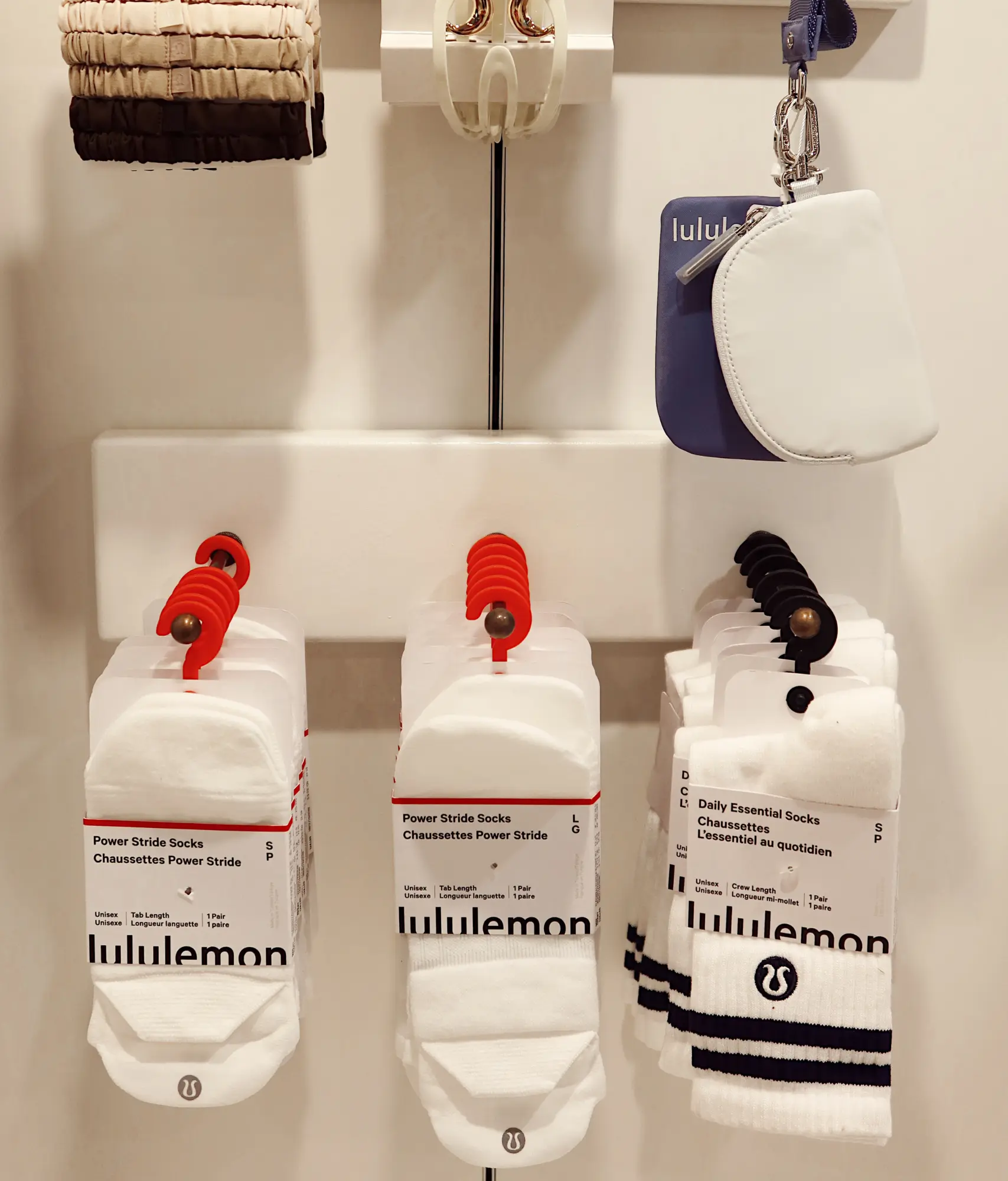Lululemon socks displayed on a retail store wall